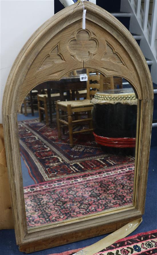 A pair of Gothic design oak frames, one fitted with a mirrored panel, W.69cm H.113cm.